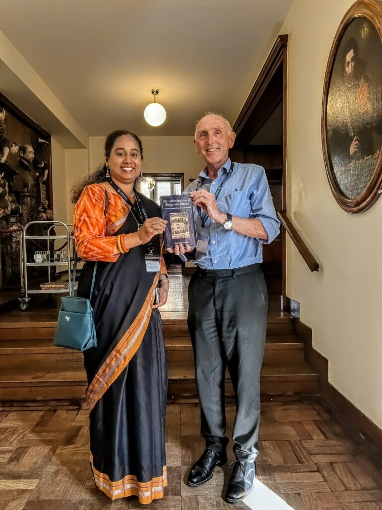 Dr. Shakuntala Gawde presenting a book to Prof. Gavin Flood
